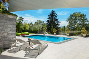 Backyard showing the true value of a swimming pool for homeowners