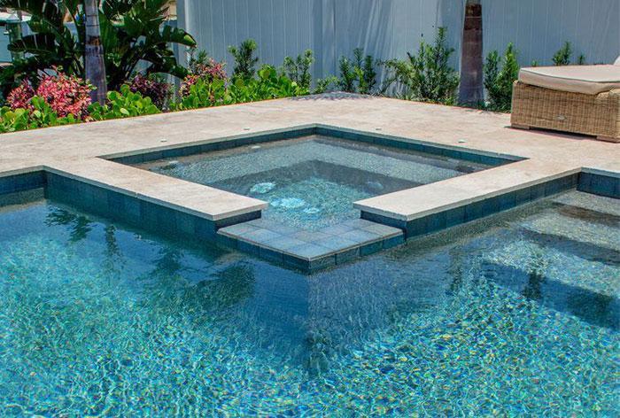 Modern jacuzzi beside swimming pool in Dubai